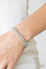 Twists and Turns - White Bracelet - Paparazzi Accessories